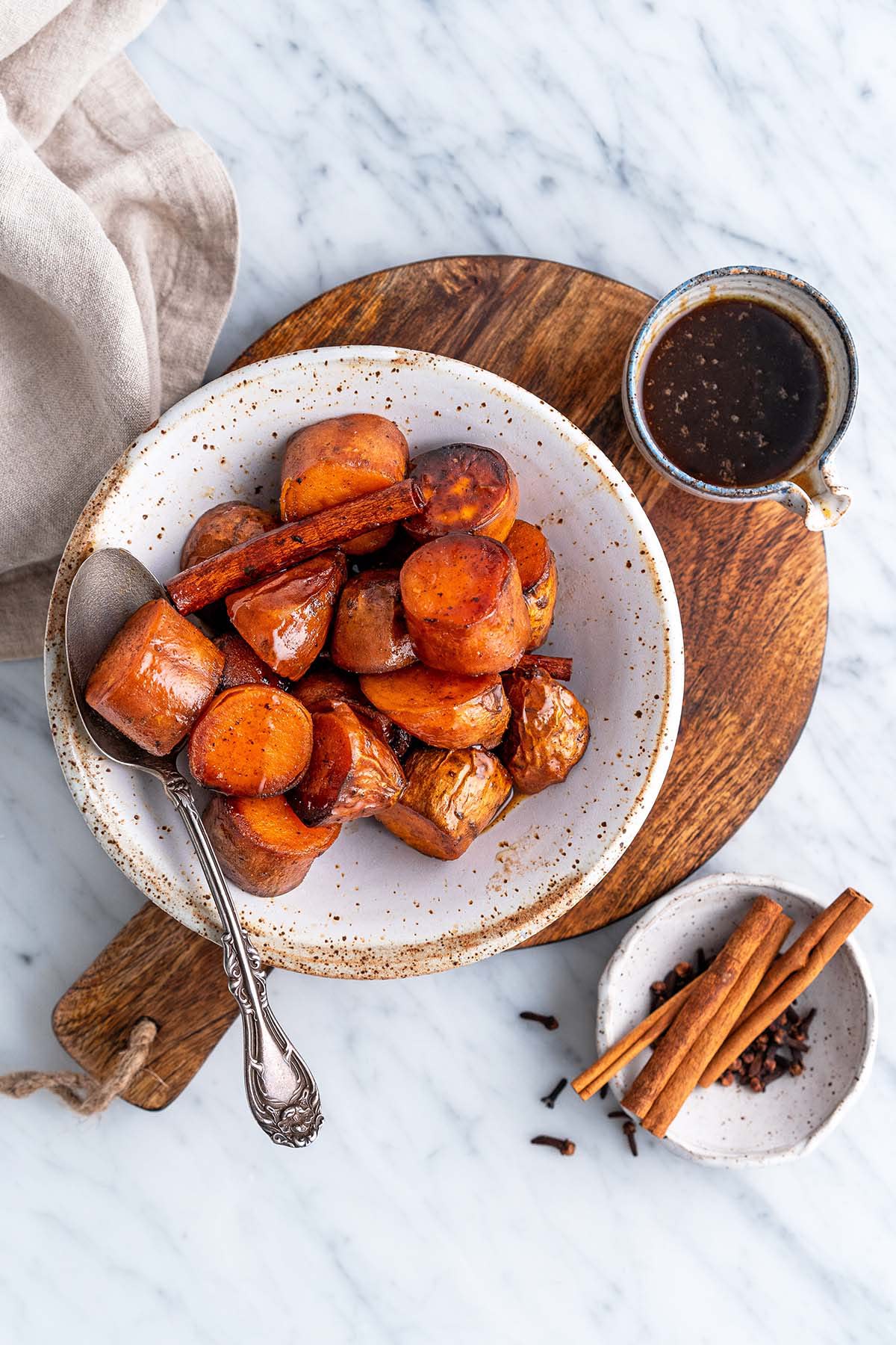 top view of easy maple melted sweet potatoes side dish recipe on marble countertop