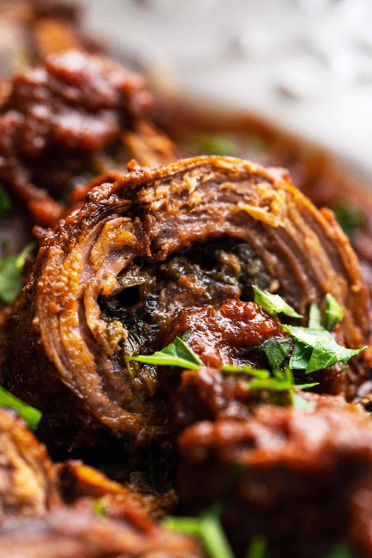 close up front view of italian braciole with spinach