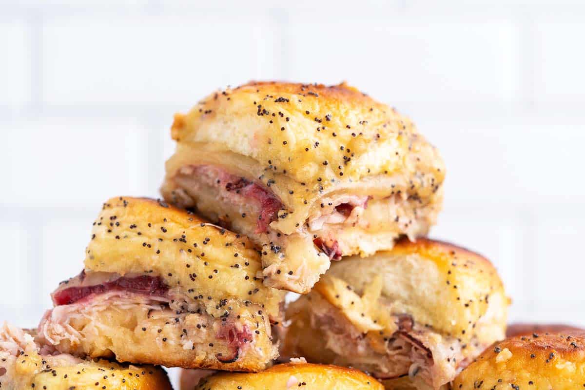 close up view of a stack of turkey sliders with cranberry sauce