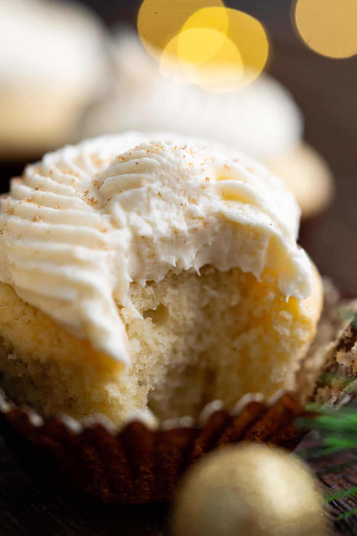 eggnog cupcake with bite showing inside