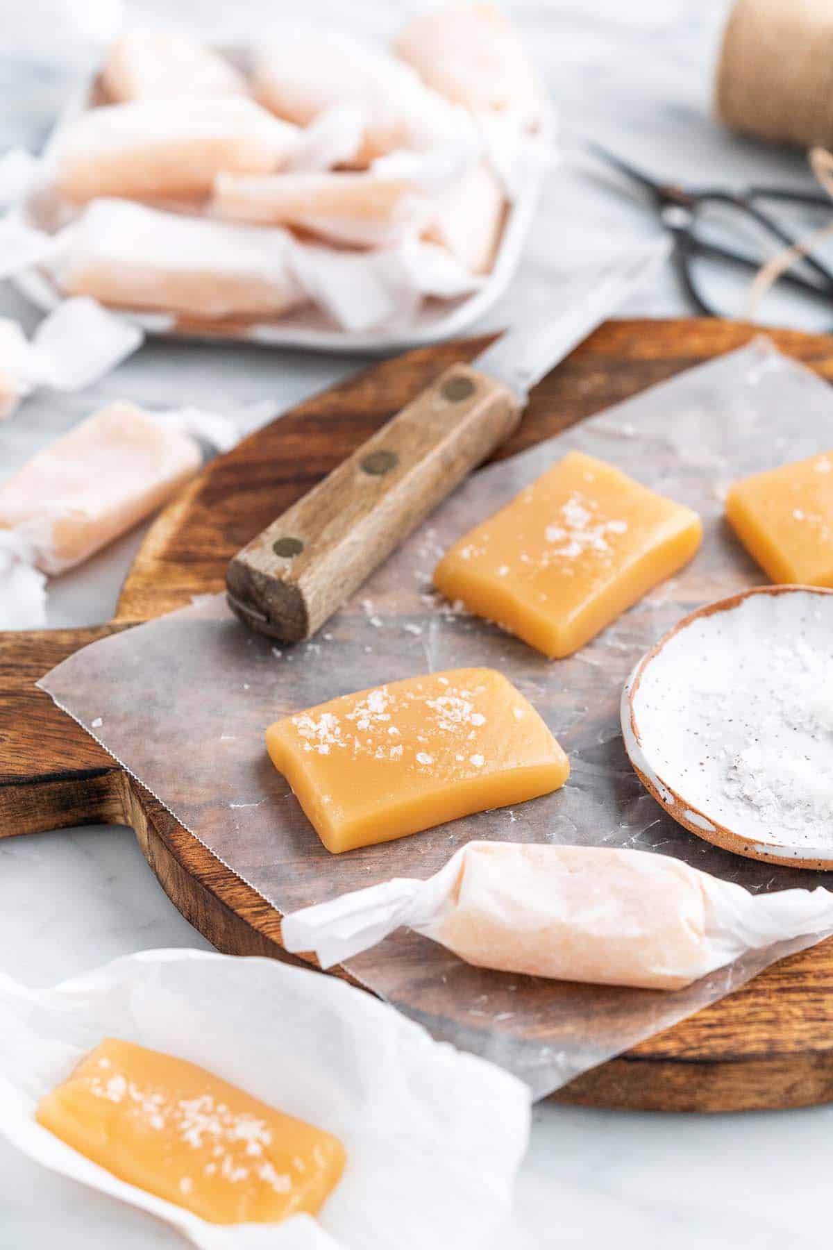 salted caramels on wooding board ready to be wrapped