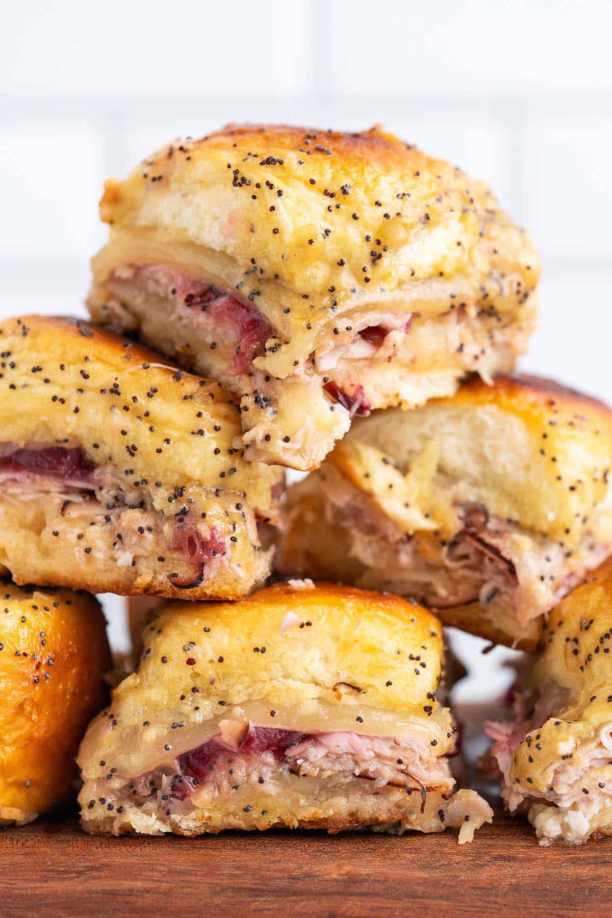 stack of turkey sliders with Swiss cheese and cranberry sauce