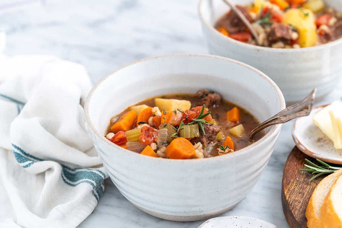 homemade beef barley soup in bowls