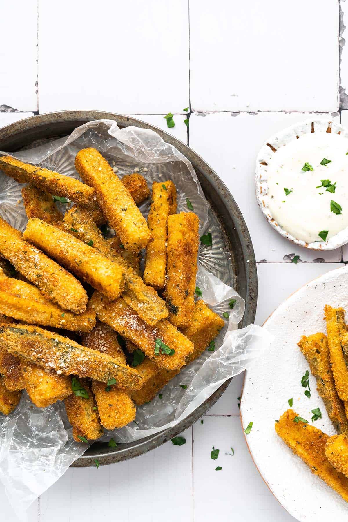 top view of baked zucchini fries on serving dish