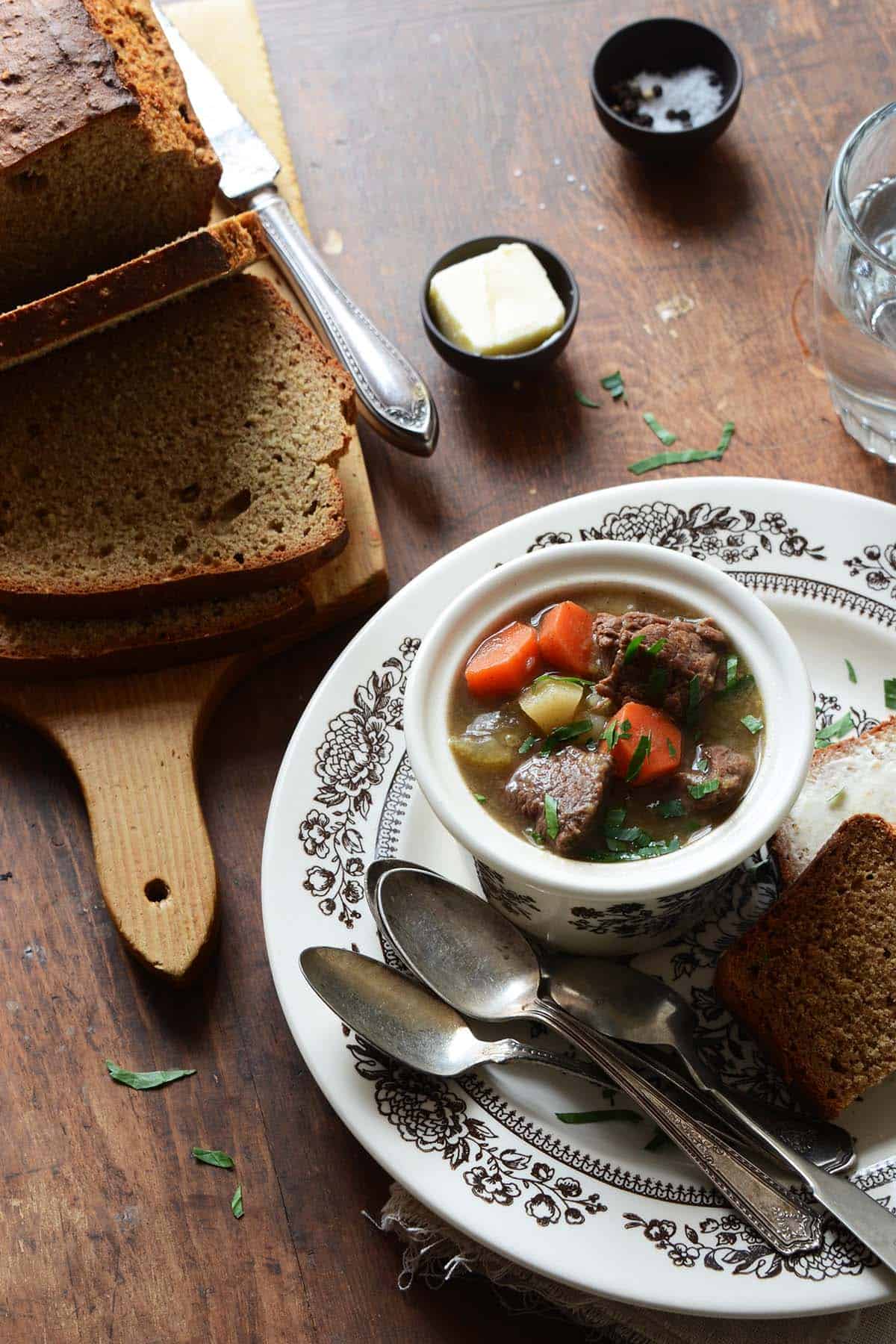 dinner spread with best guinness stew and loaf of brown soda bread