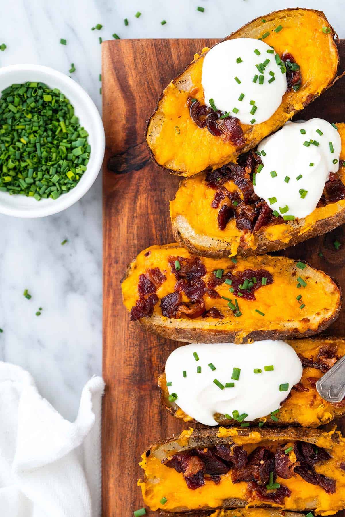 close up overhead view of cheesy air fryer potato skins