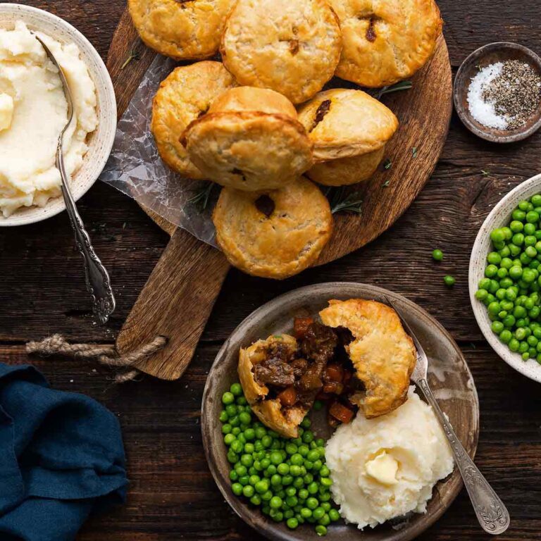 mini steak and ale pies served as full meal with mashed potatoes and peas