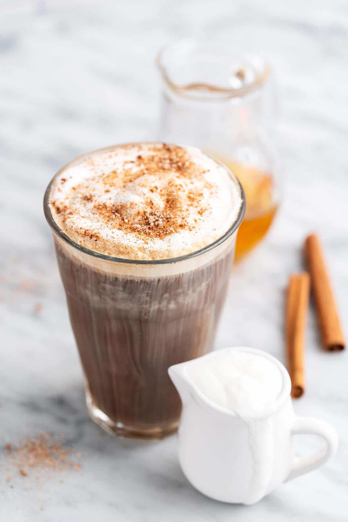 https://www.anediblemosaic.com/wp-content/uploads//2023/03/sweet-cream-cold-foam-on-iced-coffee-drink.jpg