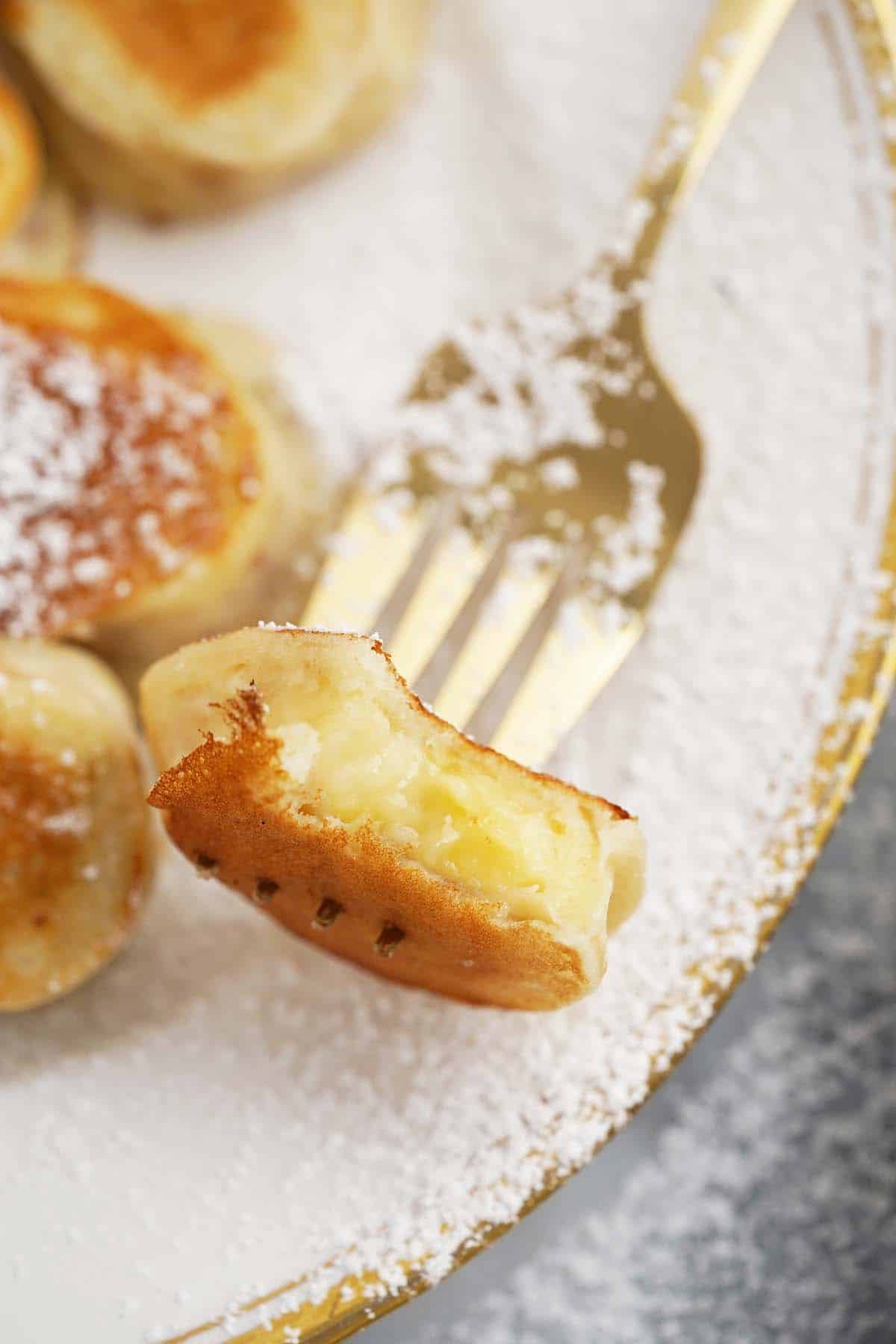 close up of bite of banana pancake on fork