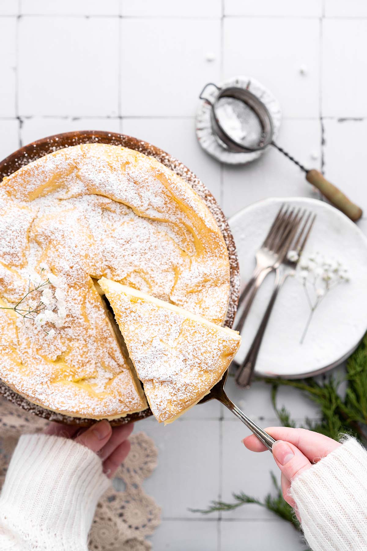 hand serving slice of polish carpathian cream cake