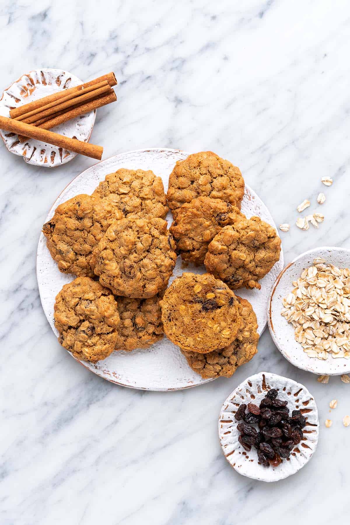 top view of healthy air fryer oatmeal cookies with raisins on white stoneware plate