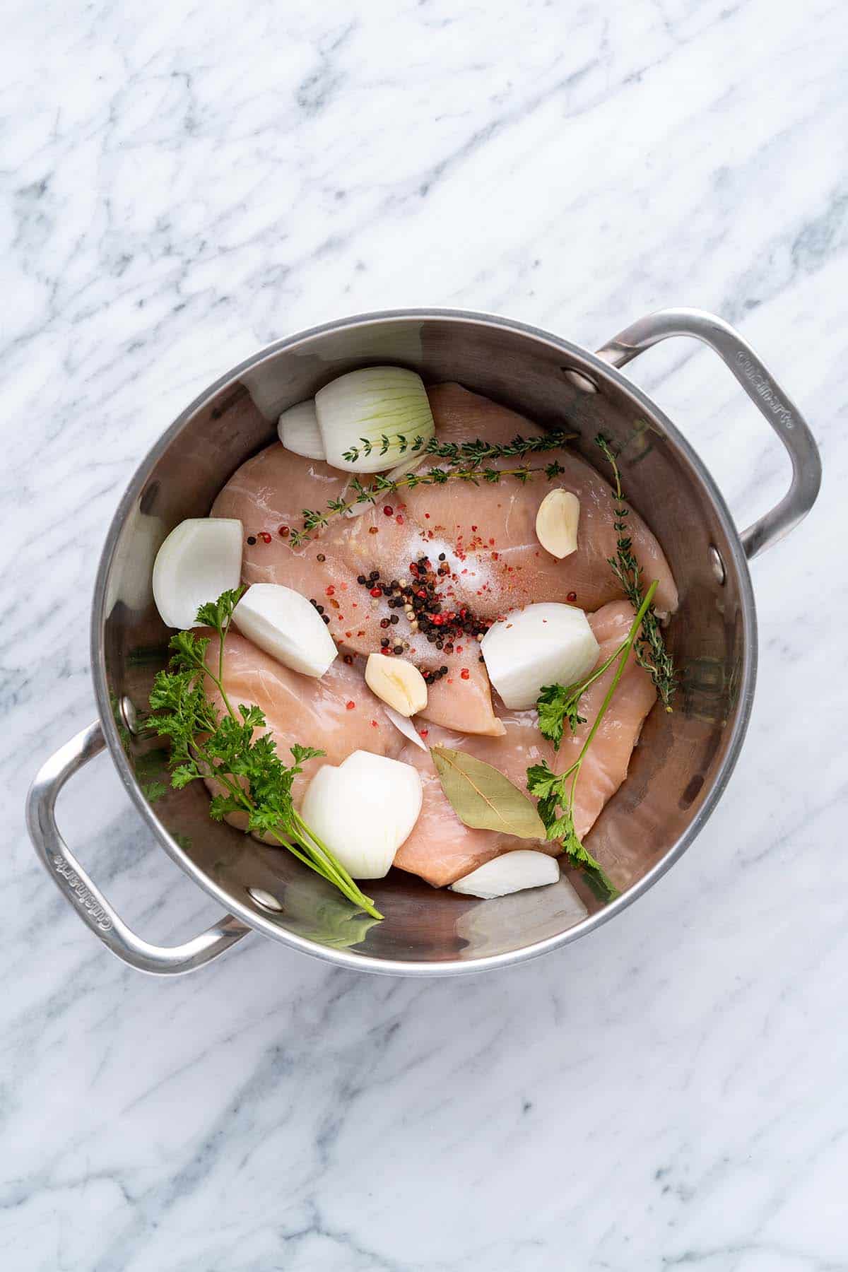 chicken with poaching aromatics in pot