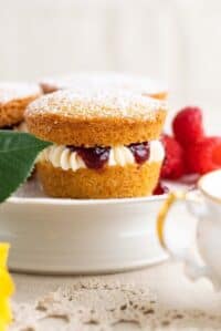 cropped-mini-victoria-sponges-on-cake-pedestal-with-english-teacup-in-front.jpg