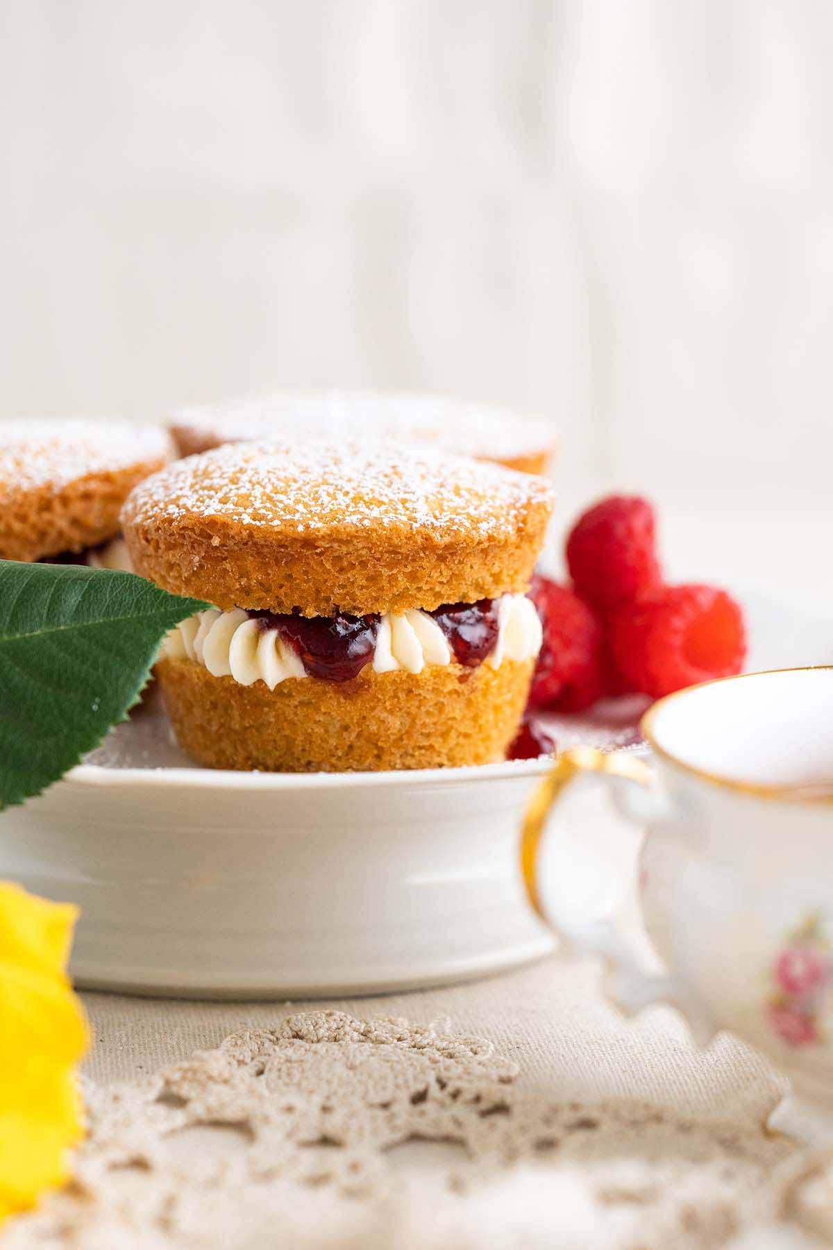 front view of mini Victoria sponges on cake platter for tea party