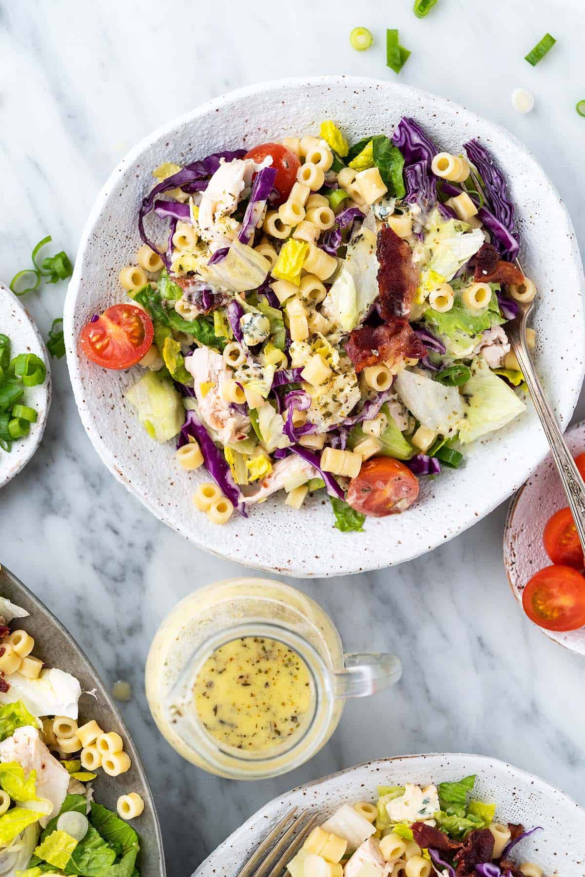 top view of portillos chopped salad copycat recipe in white handmade pottery bowl