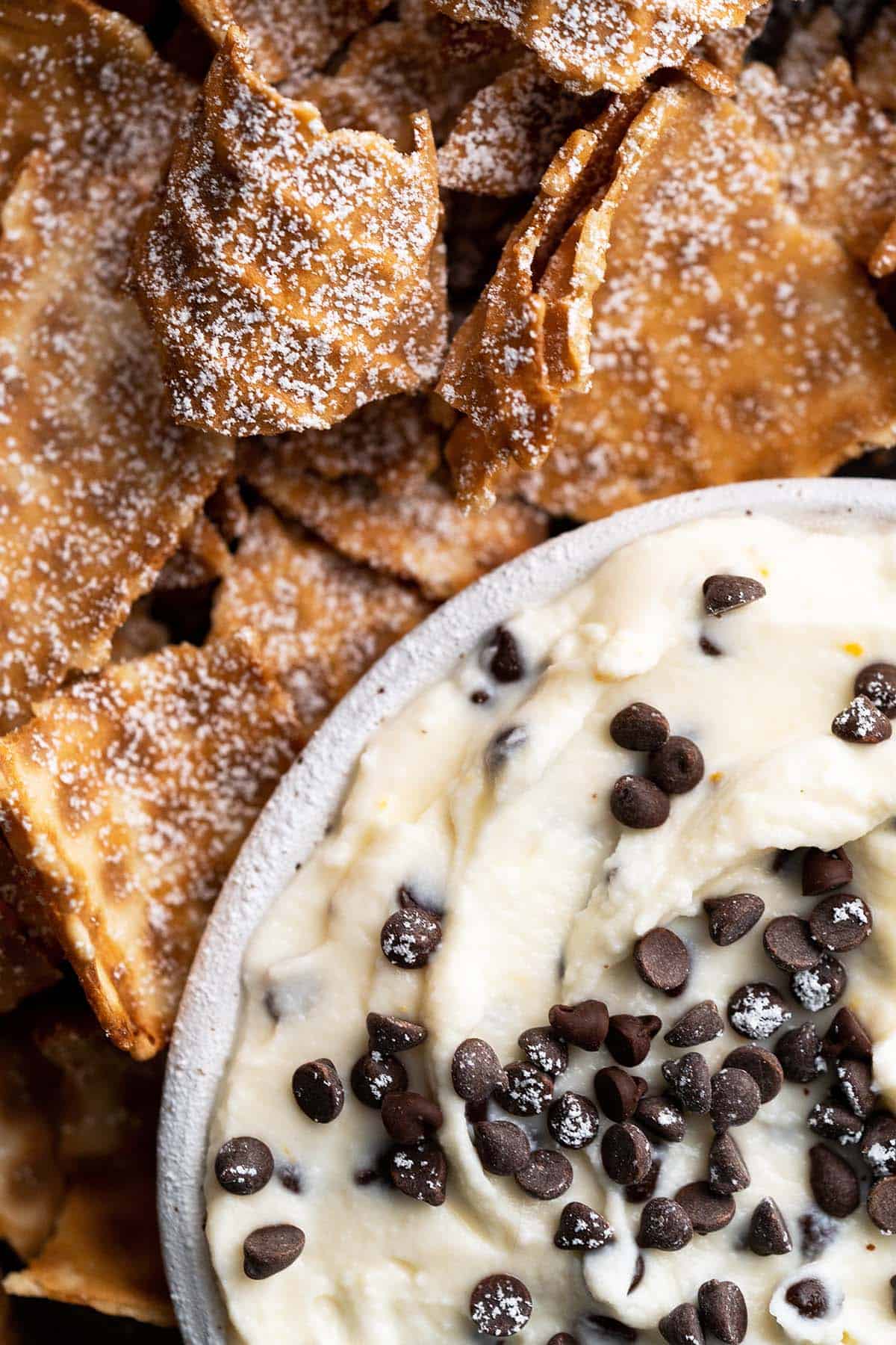 close up top view of cannoli dip and chips