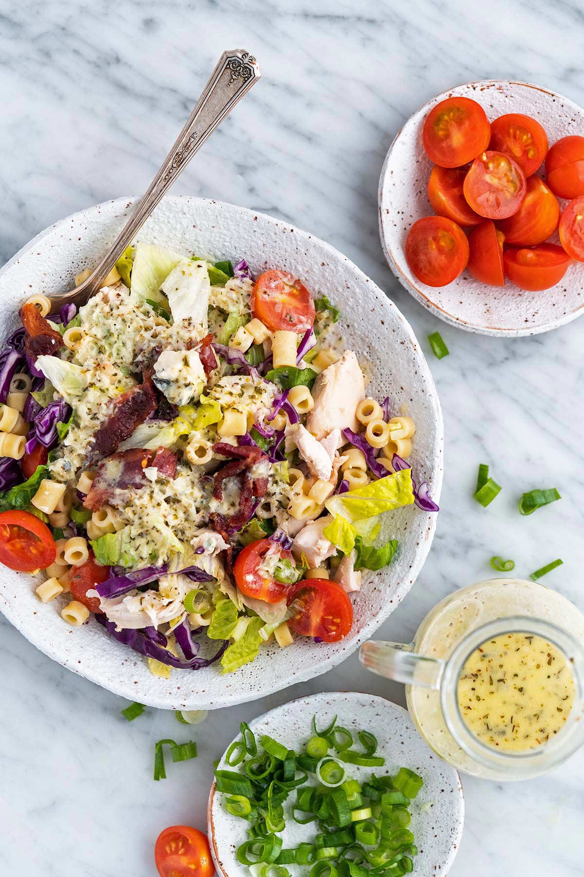 copycat portillos chopped salad recipe in bowl on marble countertop