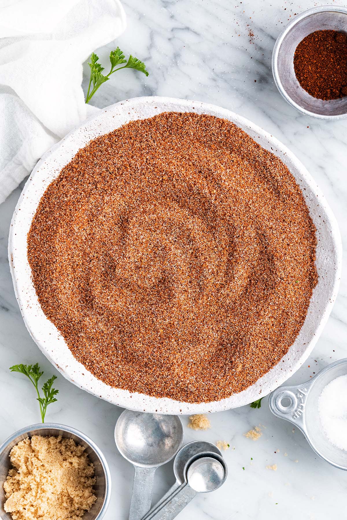 homemade bbq spice run in stoneware bowl on marble countertop