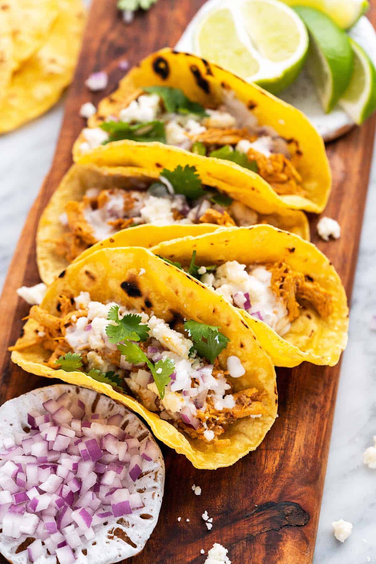 pulled chicken tacos with queso fresco and chipotle