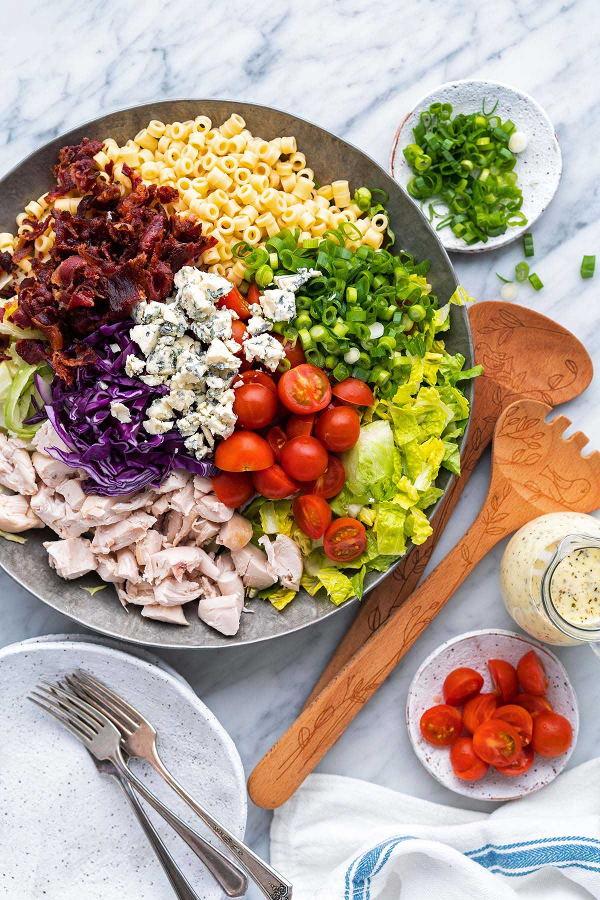 top view of Portillos chopped salad arranged in large bowl before tossing