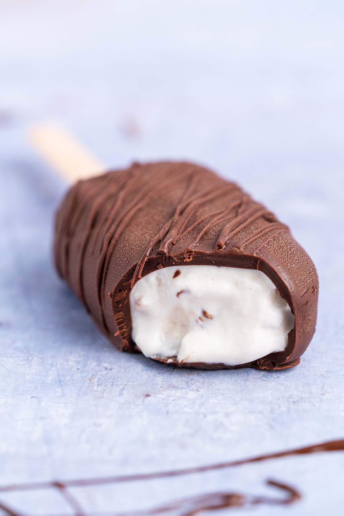 chocolate covered cottage cheese ice cream bar with bite removed