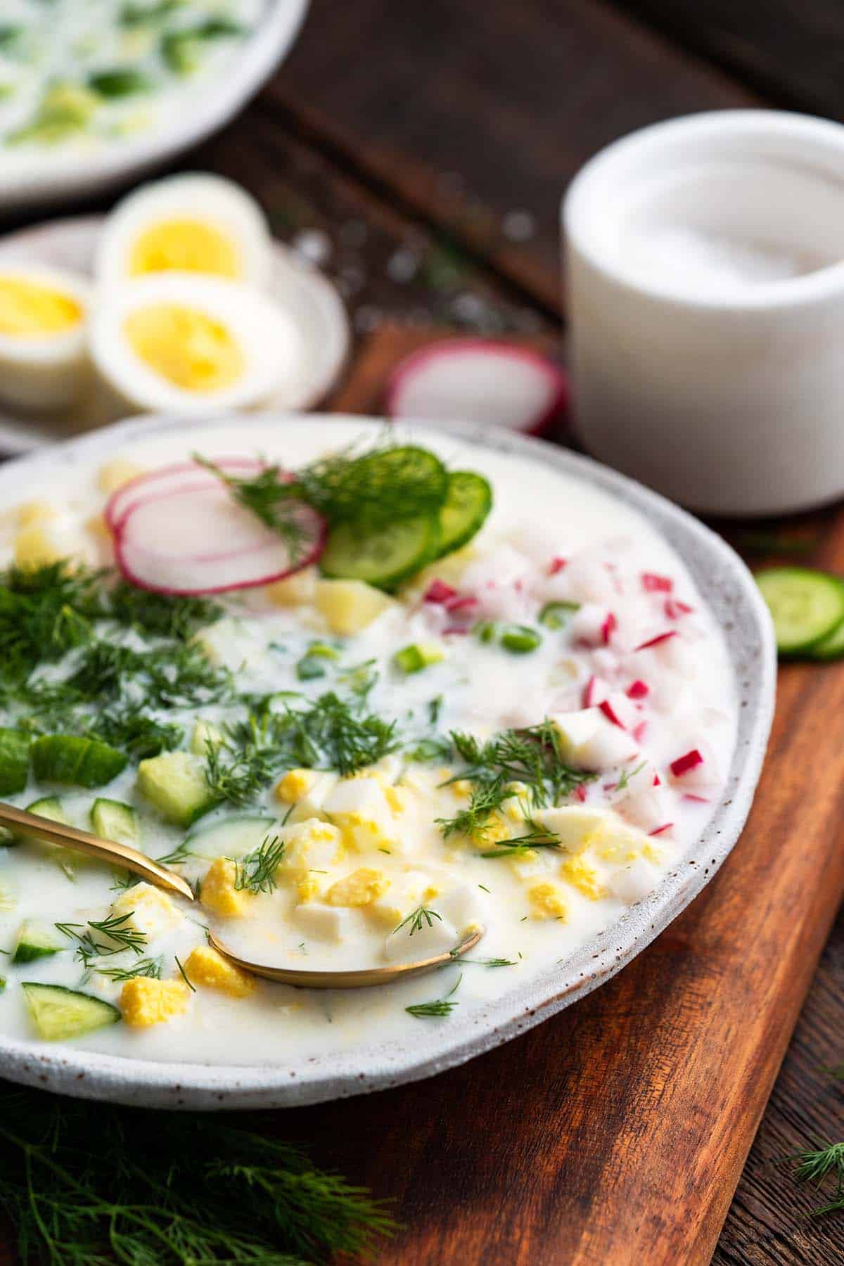 front view of chilled russian soup in handmade bowl