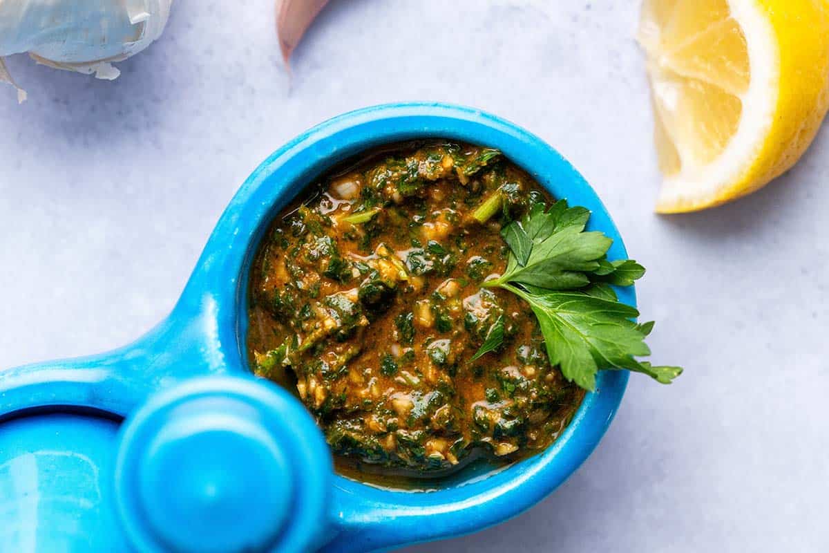 top view of fresh chermoula sauce in small condiment dish