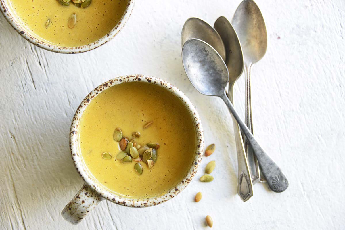 creamy pumpkin soup in mugs
