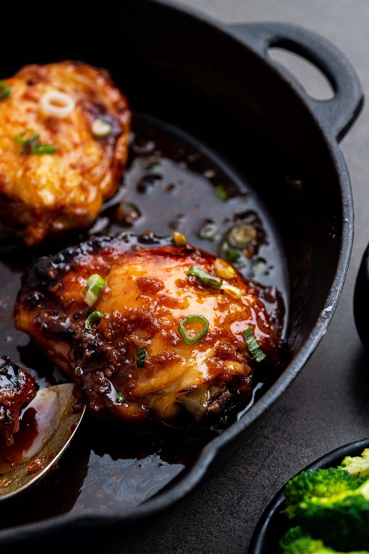 honey garlic chicken thighs with sauce in skillet