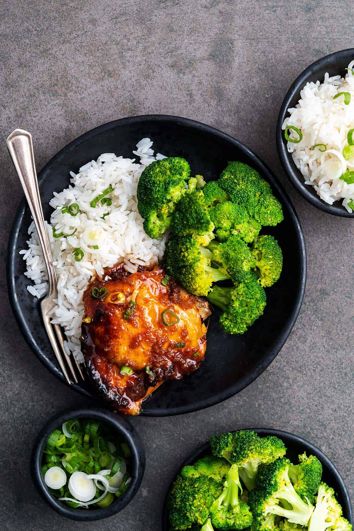 plate of honey garlic chicken with jasmine rice and steamed broccoli