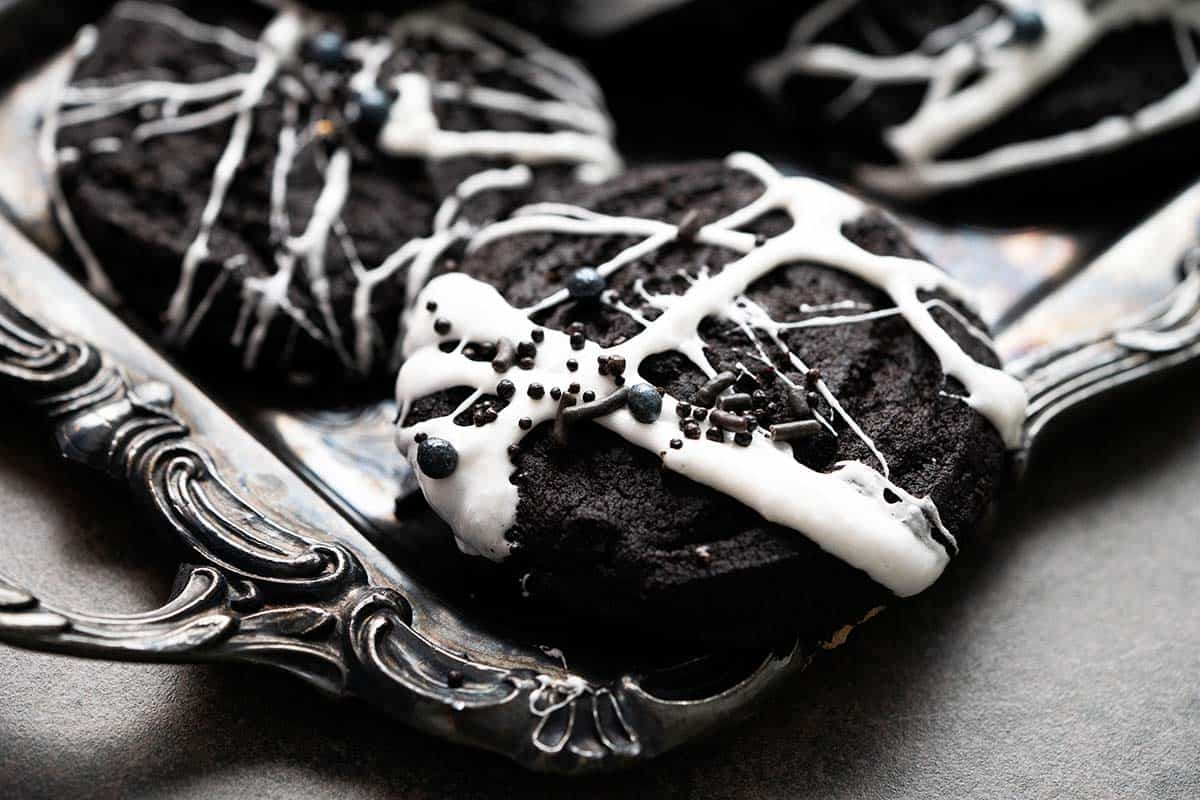 creepy spider cookies on silver tray