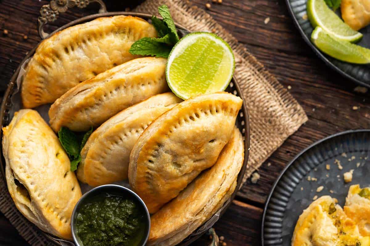 karipap on dark wooden table