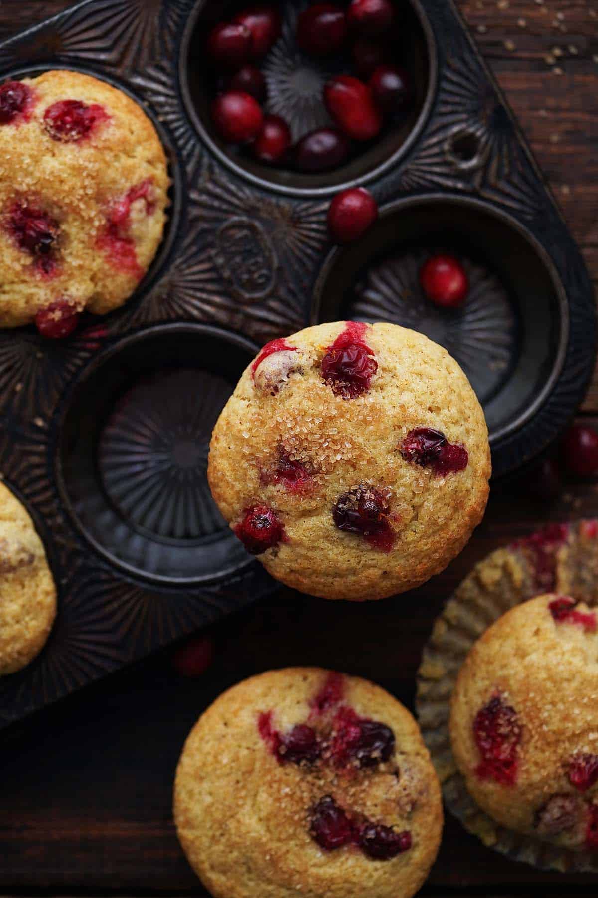 overhead view of cranberry muffins in vintage ovenex muffin pan