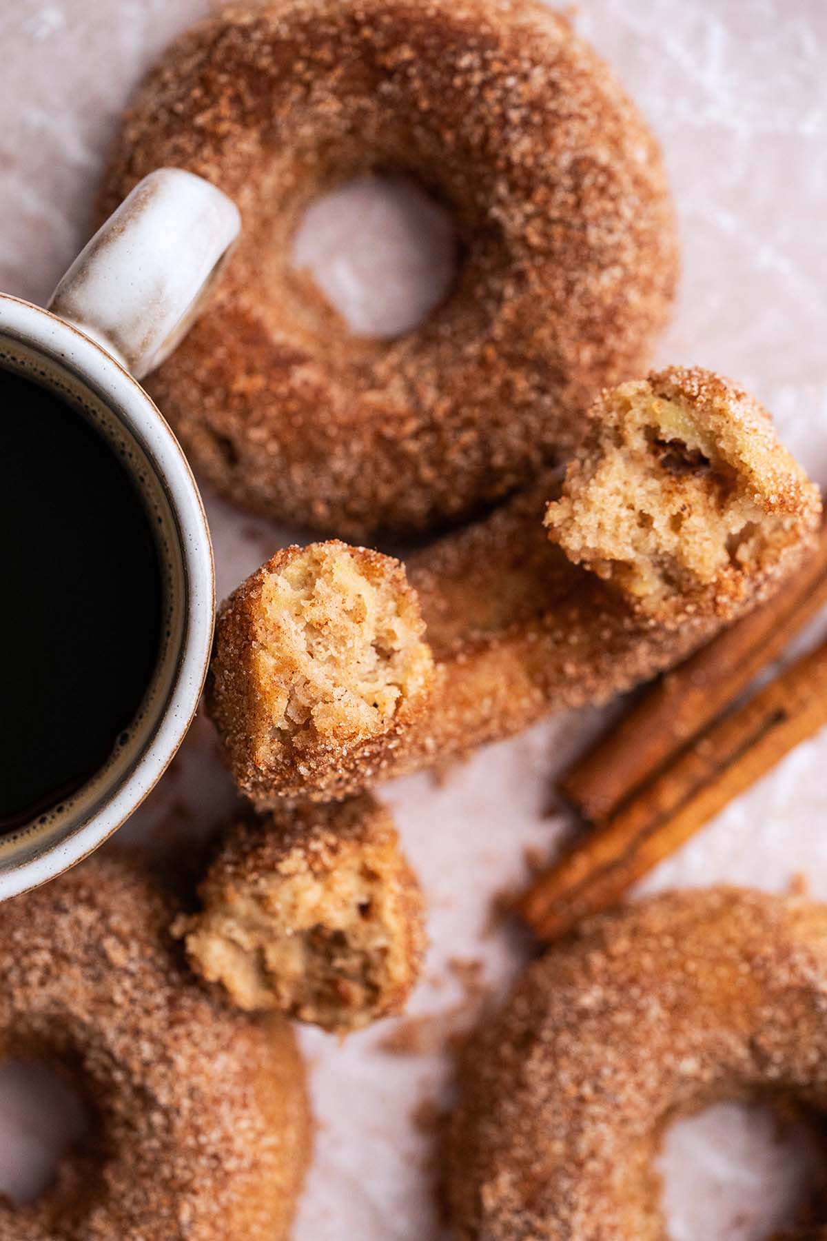 top view of apple cider doughnuts coated with cinnamon sugar