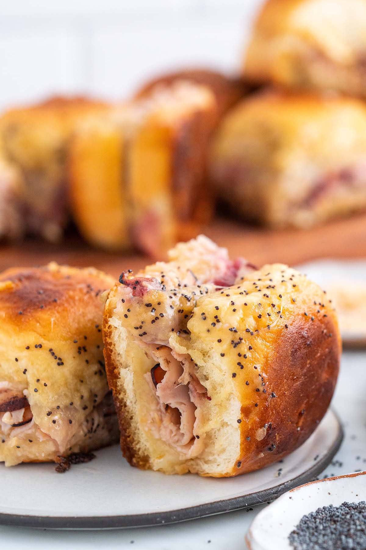 front view of Hawaiian sweet roll slider with cranberry sauce turkey and Swiss cheese