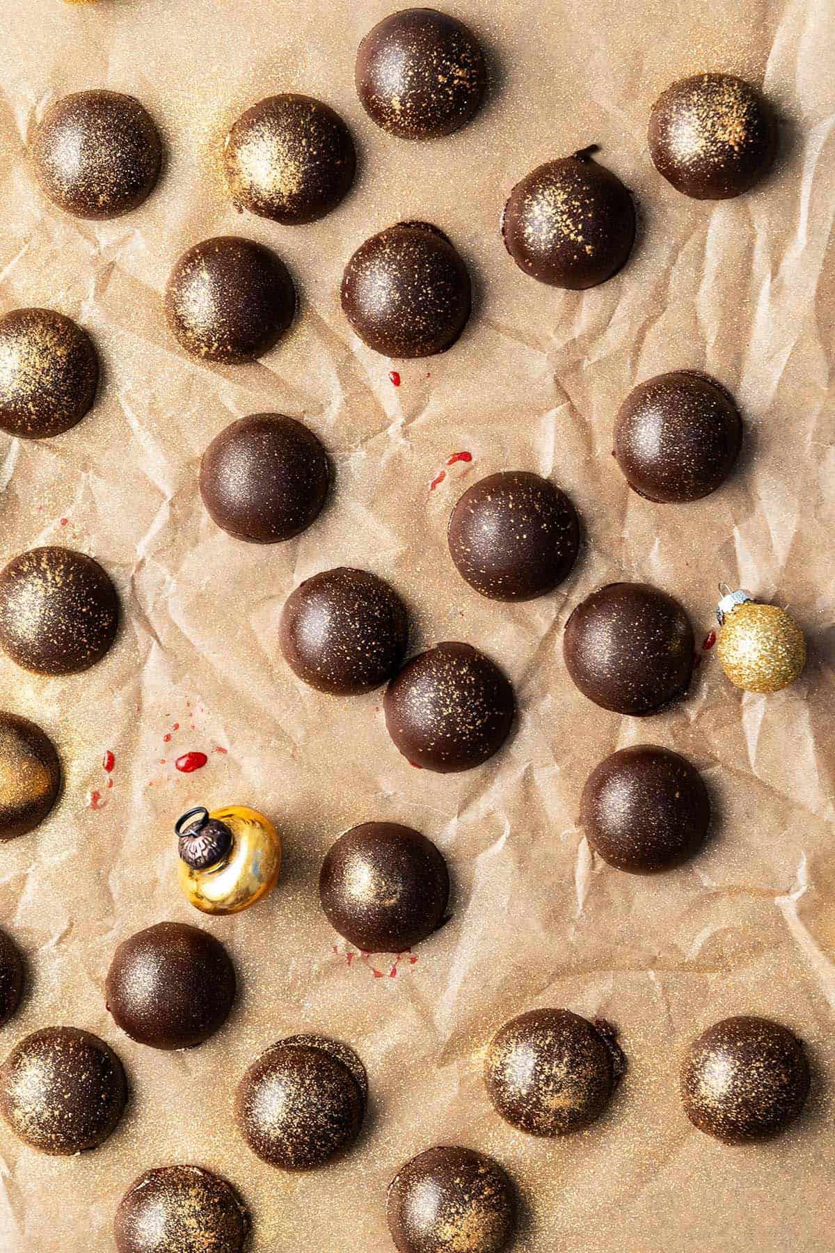 overhead view of homemade chocolate candies decorated with edible gold dust
