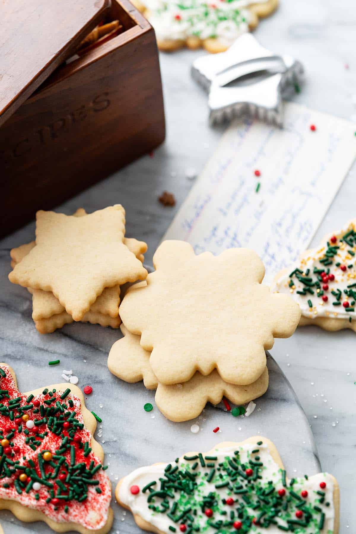 snowflake stars and christmas tree cutout sugar cookies
