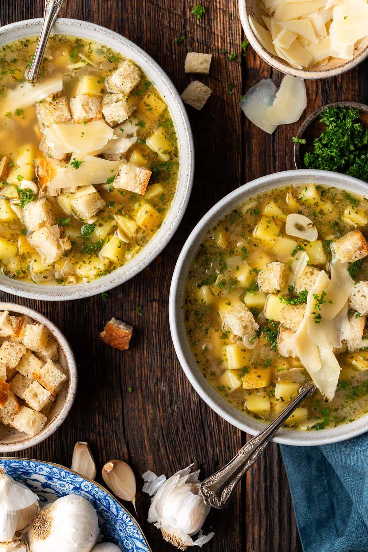 rustic table with czech garlic soup in stoneware bowls