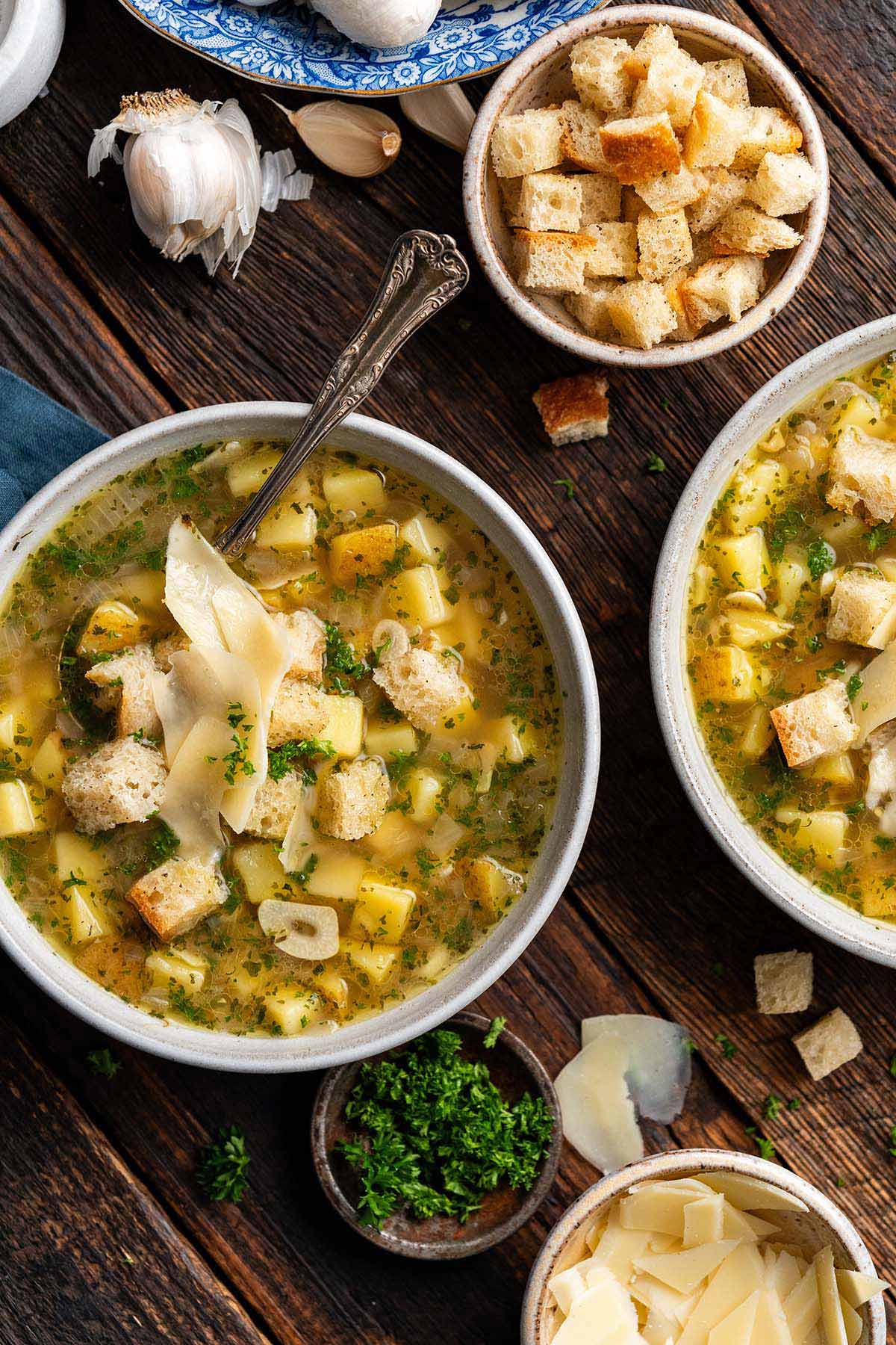 table spread with bowls of cesnecka croutons and cheese