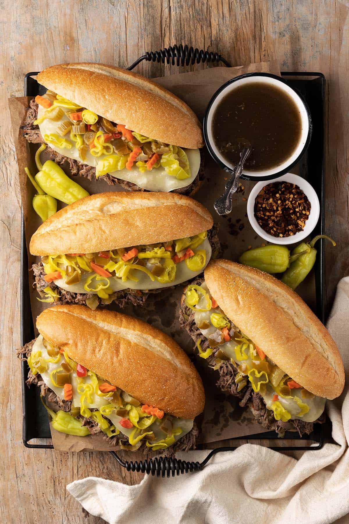 overhead view of chicago style italian beef sandwiches on platter