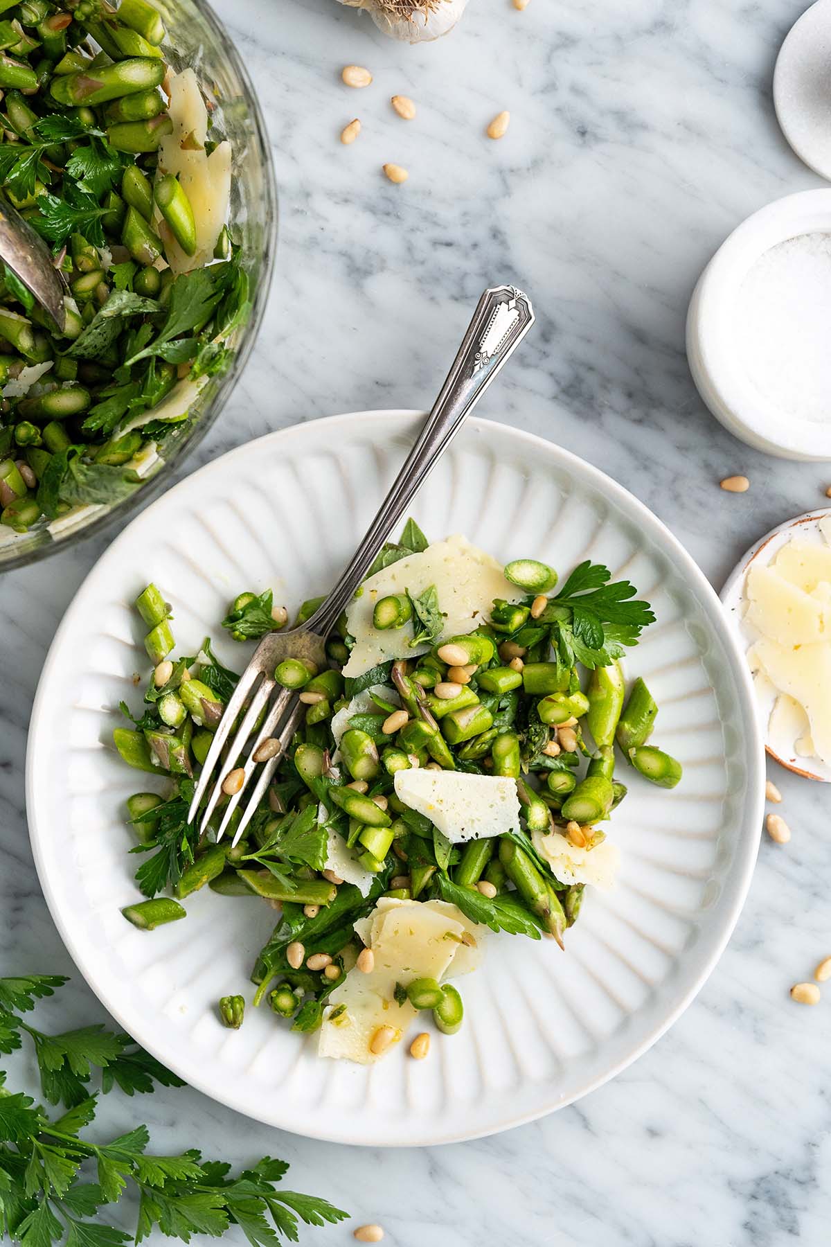 top view of healthy asparagus salad on white plate