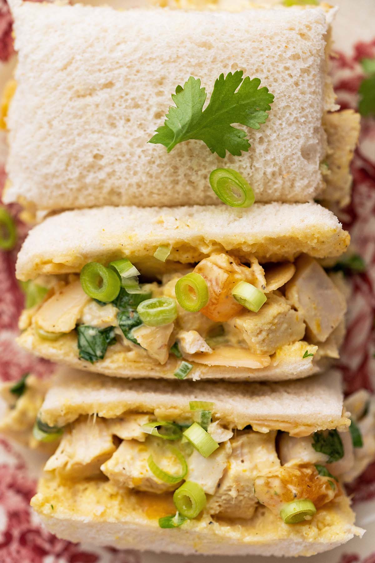 close up top view of chicken salad finger sandwiches