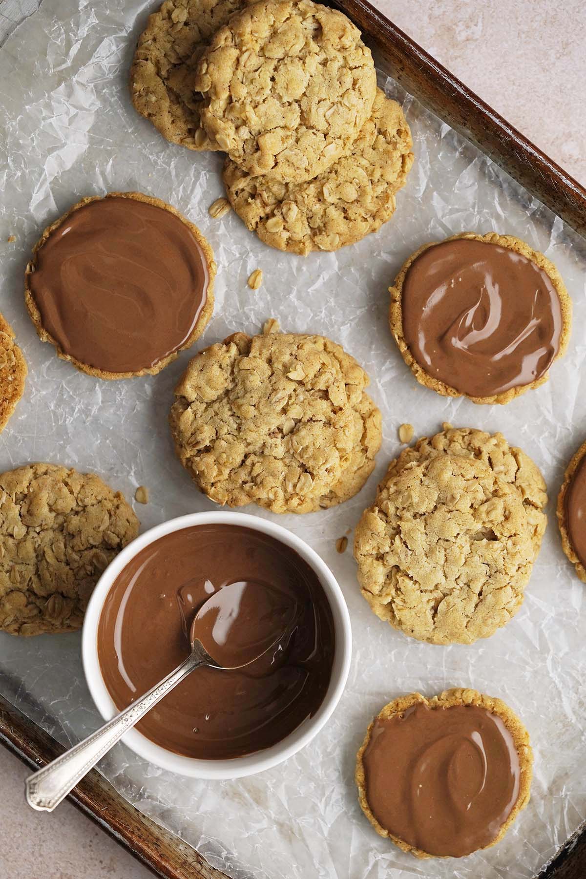 adding chocolate to crunchy oat biscuit cookies