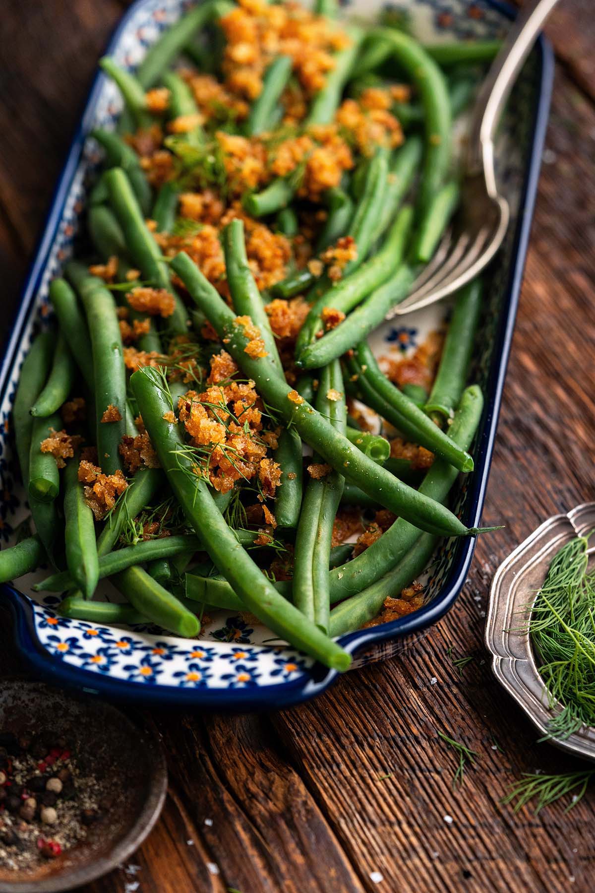 polish green beans on polish pottery platter on wooden table