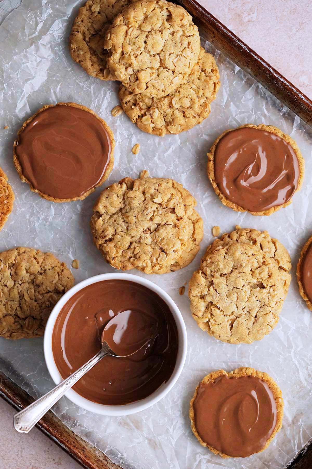 adding chocolate to crunchy oat biscuit cookies