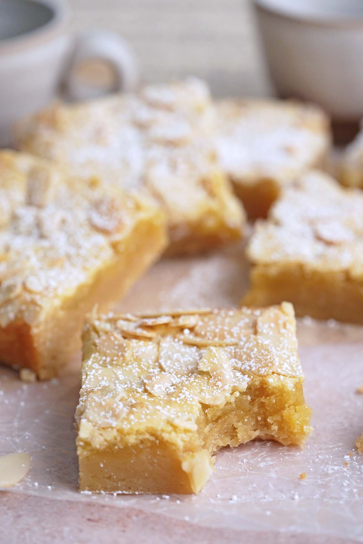 almond croissant blondies with bite in one cookie bar to show chewy texture