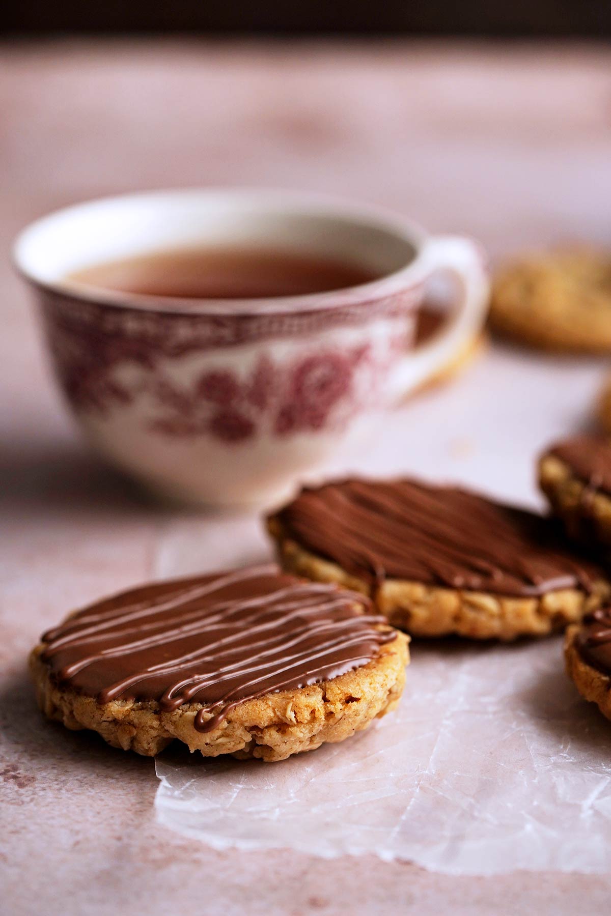 british hobnob biscuits with cup of tea in background