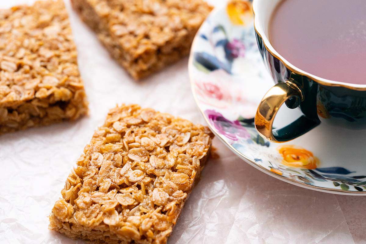 brown sugar oat bars next to tea cup