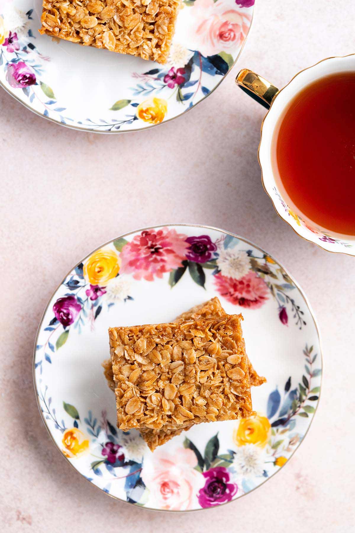 classic British flapjacks on flowered plates with tea