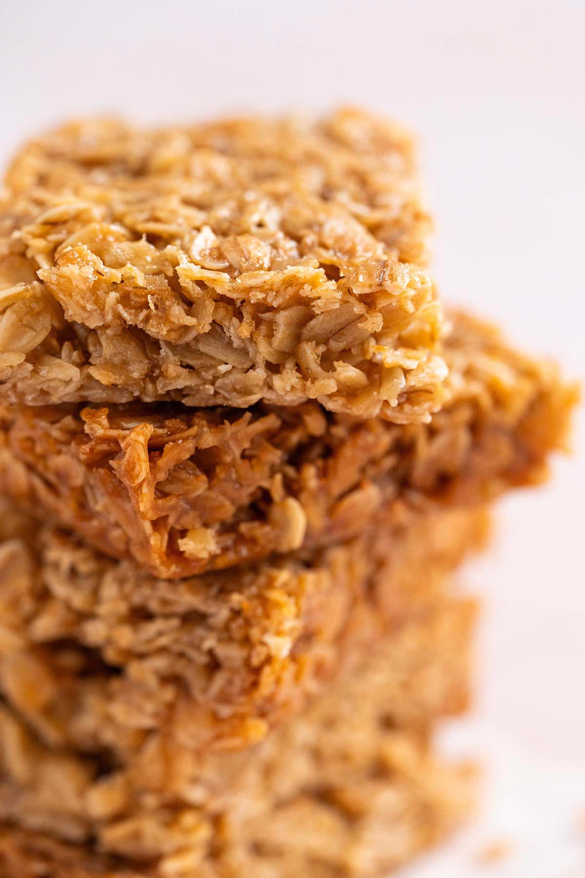 close up of stack of oat bars showing oaty texture